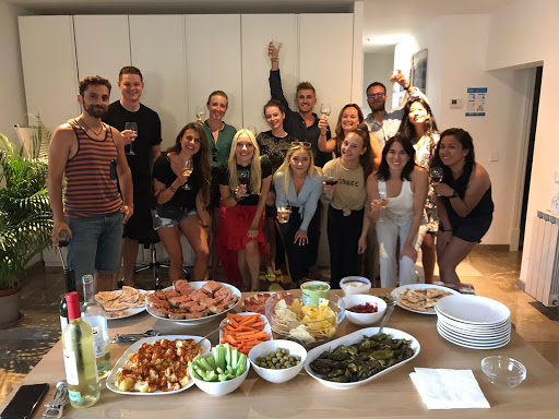 group of people behind a table of food showing how good google workspace is for business and personal development